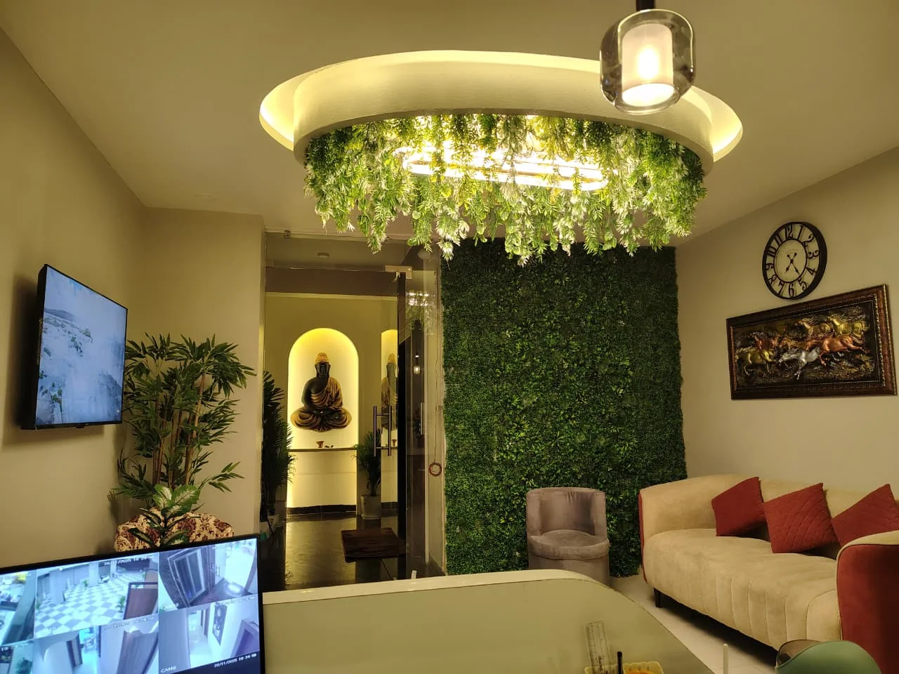 Reception lounge with botanical ceiling feature and seating at Body Spa and Wellness