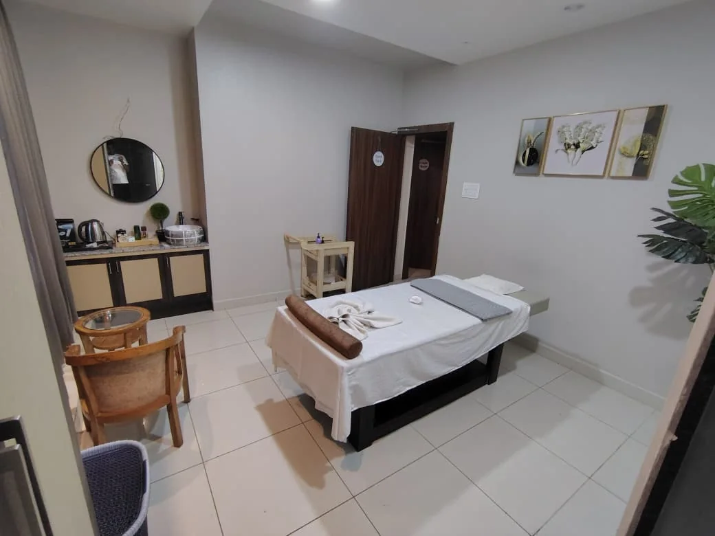 Private spa treatment room with console, mirror and seating at Body Spa and Wellness